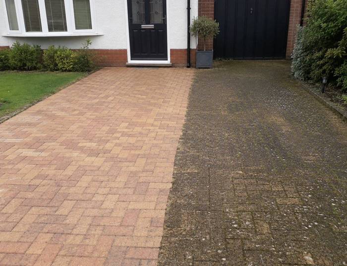 Block paving driveway half cleaned