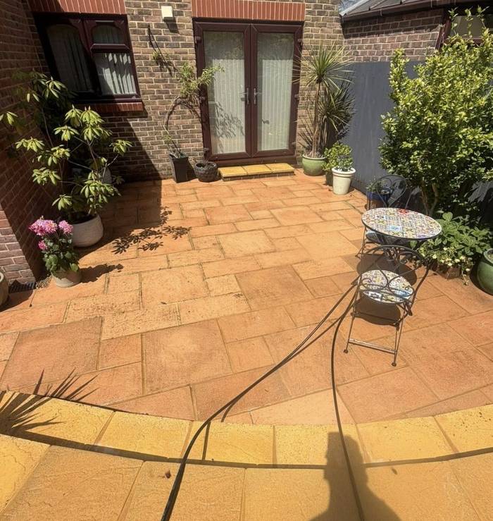Patio cleaned back to a warm sandstone colour