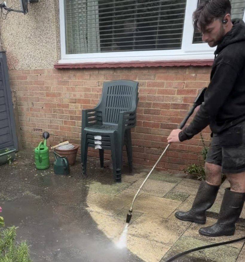 A garden patio being pressure washed