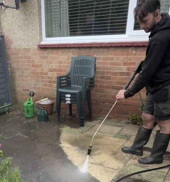 A garden patio being pressure washed