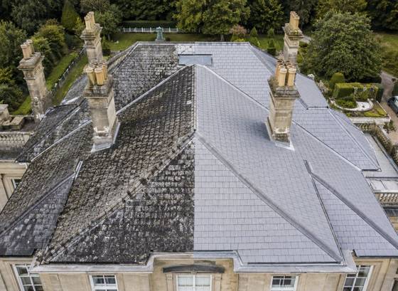 Aerial view of a large tiled roof after cleaning